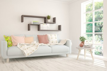 Stylish room in white color with sofa and summer landscape in window. Scandinavian interior design. 3D illustration