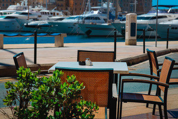 cafe near the quay with yachts and boats, travel
