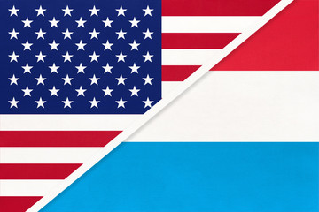 USA vs Luxembourg national flag from textile. Relationship between american and european countries.