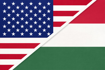 USA vs Hungary national flag from textile. Relationship between american and european countries.