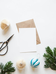 Paper card for letter, envelope and xmas decoration on white background. Top view.
