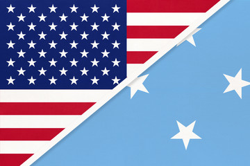 USA vs Federated States of Micronesia national flag from textile. Relationship between american and Oceania countries.