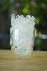 Ice tube in empty glass