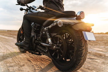 Man biker on bike outdoors at the desert field. © Drobot Dean