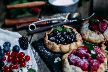 Fototapeta na wymiar biscuit with berries of blackberry, raspberry, blueberry, black currant, strawberry