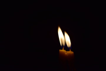 Two candle lights are shining.