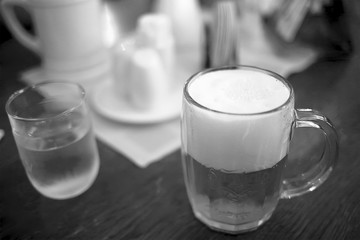 beer mug on a wooden table stands in a pub