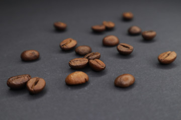  little man with coffee. grain on a dark background.