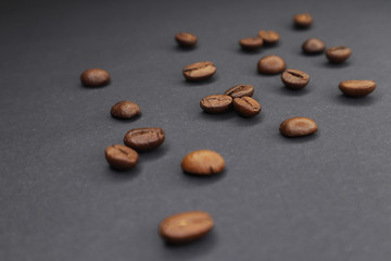  little man with coffee. grain on a dark background.