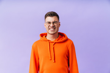 Young man isolated wearing eyeglasses.