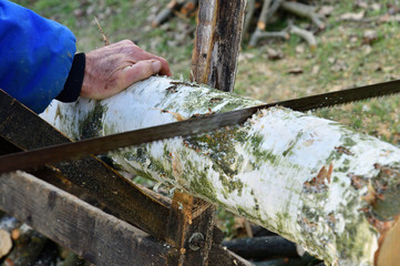 Detail of a wood sawing traditionally in the village