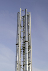 metal shiny pipes against blue sky