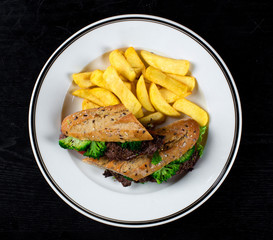 sandwich with meat and broccoli and homemade potatoes