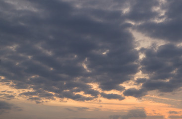Fototapeta premium thick dark clouds at sunset
