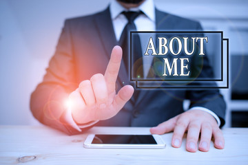 Writing note showing About Me. Business concept for telling someone list of your good and bad traits and past events Male human wear formal clothes present use hitech smartphone