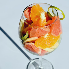 Fototapeta na wymiar fruit slices in a wine glass, isolate