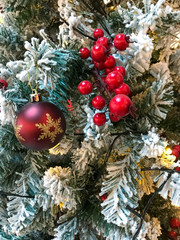 Christmas tree with red colored decorations, New Year Celebration.