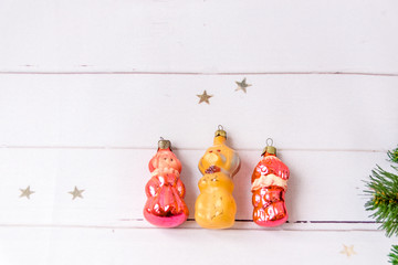 Old toys lie on a wooden board. Selective focus.