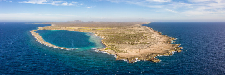 Aerial view of coast of Curaçao in the Caribbean Sea with turquoise water, cliff, beach and beautiful coral reef around Eastpoint