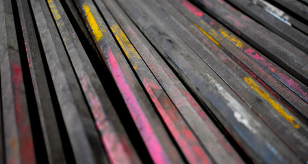 metal bars with traces of peeling bright paint