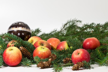 Christmas still life with pine branches, pine cones and apples  on a white background/ Merry Christmas / Happy New Year