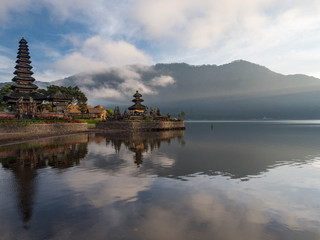 Fototapeta premium Indonesia, november 2019: Pura Ulun Danu Bratan temple in Bali island. Hindu temple in flowers on Beratan lake, Asia. Major water temple Bali. Hindu water temple - culture symbol of Indonesia,
