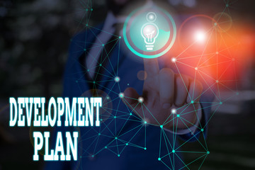 Writing note showing Development Plan. Business concept for the planning of the development of an area of land