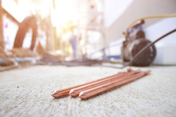The ground bar is made of copper to prevent short circuits.  Used in air-conditioning installation work