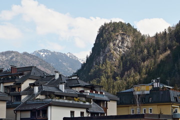 Morning. The view from the window of the roofs of the houses against the backdrop of the mountains.