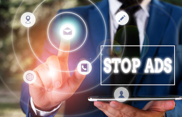 Conceptual hand writing showing Stop Ads. Concept meaning program that will remove different kinds...