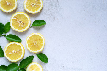 sliced fresh lemon with green leaves