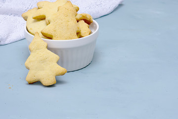 Christmas homemade cookies in the form of trees in a white plate. Holiday concept, christmas, house