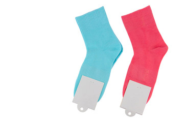 New socks on a white background. Colorful socks with beige label for your design. Isolated object