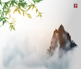 Ink wash painting with green bamboo tree and high misty mountain peak. Traditional oriental ink painting sumi-e, u-sin, go-hua. Hieroglyph - happiness.