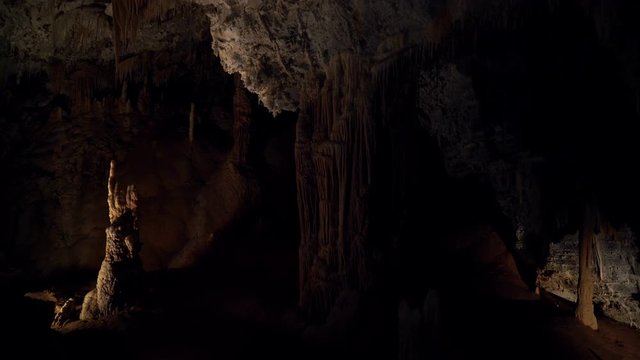 Beautiful Giant Cave With Mysterious Light. Stalactites And Stalagmites Illuminated By Beautiful Changing Light. Giant Grotto Underground. Underground Kingdom. Journey To The Center Of The Earth.