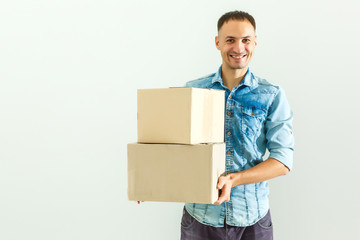 Deliveryman holding cardboard box isolated on white background
