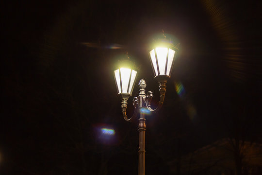night street lamp in the dark. vintage lamppost in the nightlife outdoors