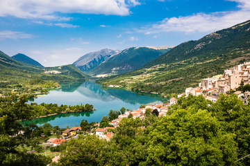 Fototapeta na wymiar Barrea, Italy: the Historical Typical Village seen from Top, with Mountains and Lake Landscape Panorama