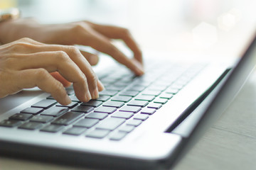 woman using laptop, searching web, browsing information, having workplace at home