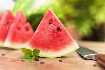 Slices of delicious watermelon on the table outdoors