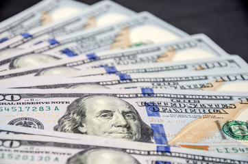 dollars on a black table, close-up.