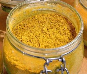 yellow curry powder in the glass jar