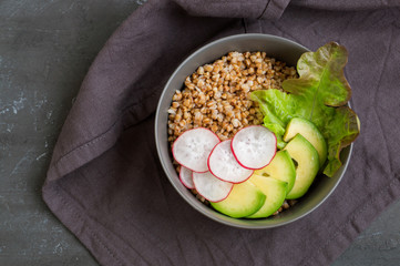 Healthy dish with buckwheat and vegetable salad. Buddha bowl. Balanced food. Delicious detox diet.Top view