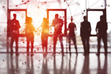 Concept background with business people silhouette looking out of the window. Double exposure with...