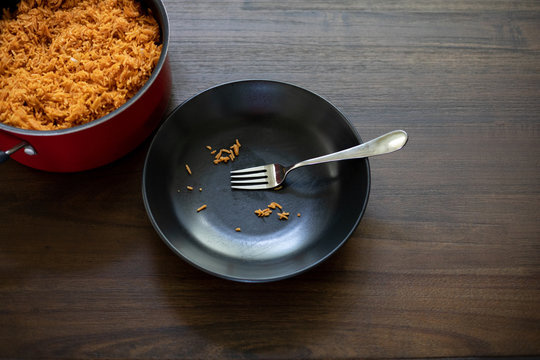 Empty plate of jollof rice
