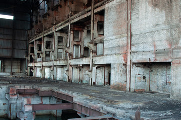 Fototapeta na wymiar Inside a large abandoned industrial building