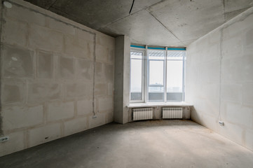 Russia, Moscow- July 16, 2019: interior room. rough repair for self-finishing. interior decoration, bare walls of the room, stage of construction