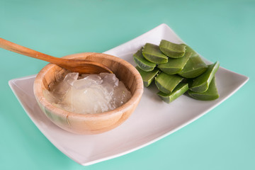 aloe vera leaves and wooden bowl 