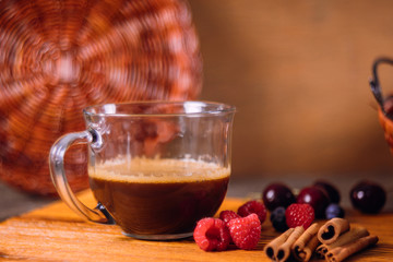 Homemade delicious cinnamon rolls with coffee and cinnamon sticks selective focus