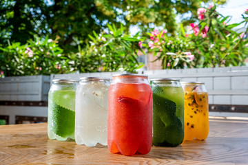 Healthy smoothie from summer fruits and berries in a jars with straws